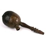 An Islamic carved coconut shell water pipe, 32cms high.