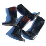 A pair of black leather riding boots with wooden trees; together with three pairs of boots.Condition