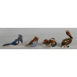 A group of Royal Crown Derby paperweights to include a Blue Jay, a brown Pelican, Waxwing and