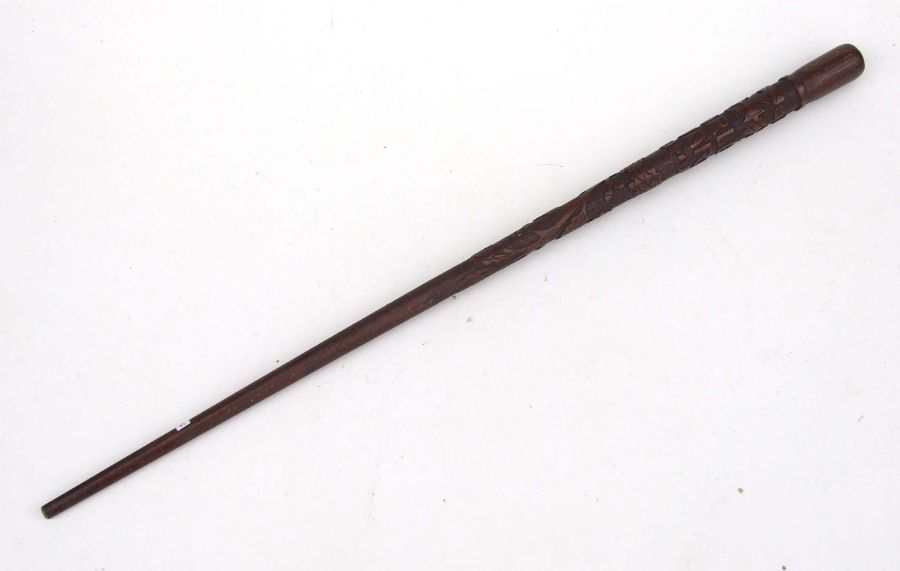 A WWI POW carved walking stick, carved with script, oak leaves and Iron crosses, 85cms long.