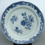 An 18th / 19th century Chinese Export blue & white charger decorated with flowers, 41cm diameter.