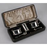 A George III style silver five-piece condiment set, various dates and makers, cased.