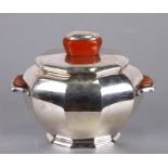 An Art Deco continental silver coloured metal sucrier of faceted ovoid form, weight 256g, 14cms