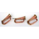 Three copper & brass military bugles, each approx 31cms long (3).