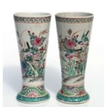 A pair of Chinese famille rose vases of tapering form decorated with birds, flowers and insects,