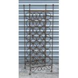 A free standing iron work 21-bottle wine rack, 31cms wide.