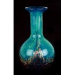 A Dale Tiffany turquoise Art glass and aventurine vase, 23cms high.