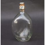 A silver mounted dimple whisky bottle, Birmingham 1925, 22cms high.