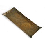 A small Art Nouveau rectangular brass tray with impressed owl and floral stylised decoration,