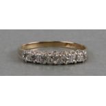 A 9ct gold seven-stone diamond ring, approx UK size 'O', weight 1.5g.