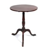 A 19th century oak tilt-top occasional table on turned column and tripod base, 56cms diameter.