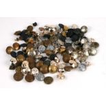 A quantity of militaria to include buttons for various regiments, cap badges, shoulder flashes,