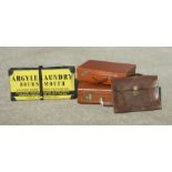 Two vintage leather suitcases, the largest 54cms wide; a leather attaché case and an Argyle