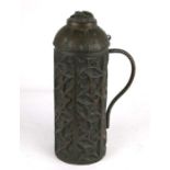 A large late 19th century brass lidded vessel with Gothic relief decoration, the hinged lid with