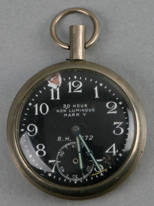 A WWI Royal Flying Corps (RFC) cockpit pocket watch, the black dial with Arabic numerals and