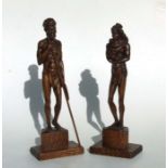 A pair of Australian carved wood Aboriginal figures, signed 'Frentz', each 35cms high (2).