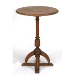 A Gothic Revival Pugin style oak occasional table on quatrefoil base, 52cms diameter.Condition