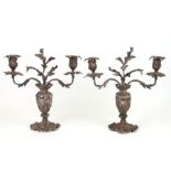 A pair of Victorian silver plated candelabra in the rococo style, 33cms high (2).