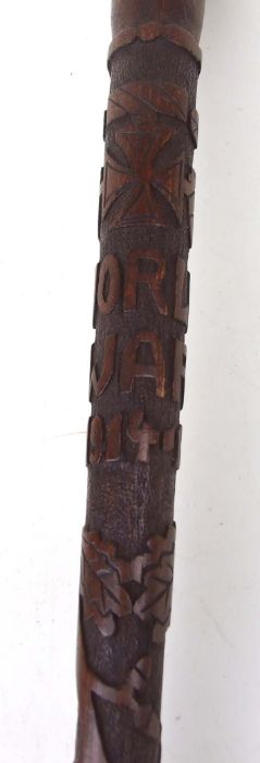 A WWI POW carved walking stick, carved with script, oak leaves and Iron crosses, 85cms long. - Image 3 of 4