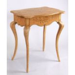 A continental distressed painted occasional table decorated with flowers on a yellow ground, 71cms