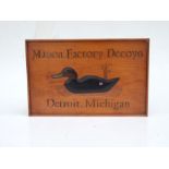 A carved wooden advertising plaque - Mason Factory Decoys, Detroit, Michigan - 47cms wide.
