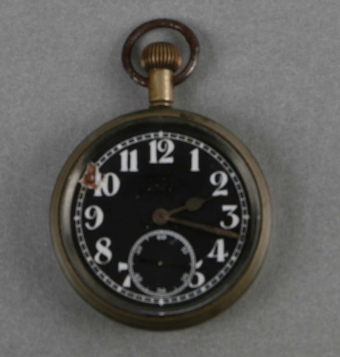 A WWI Royal Flying Corps (RFC) cockpit pocket watch, the black dial with Arabic numerals and