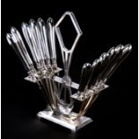 A set of twelve WMF dessert knives in a stand, 20cms high.