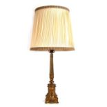 A large gilt metal classical form table lamp, 54cms high (overall including shade 98cms high).