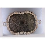 A Victorian cast Sheffield plate two-handled tray with floral engraved decoration within a grape and