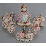 A group of continental porcelain figures, mostly ladies wearing crinoline dresses, Capodimonte and