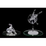 A Swarovski crystal ballerina on her points; and another similar seated, largest 14cms high (2).