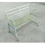 A distressed painted slatted metal garden bench, 123cms wide.