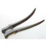 A North African hunting sword with aluminium hilt. Having a single edged curved blade 52cms (20.