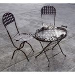 A pair of French wrought iron garden chairs and matching folding table (3).