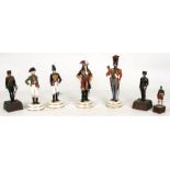 A group of limited edition models of soldiers in military dress; together with other military