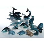 A collection of Poole Pottery blue glazed figures to include dolphins, crocodile, owl and tortoise