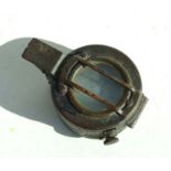 A WWI military issue compass.