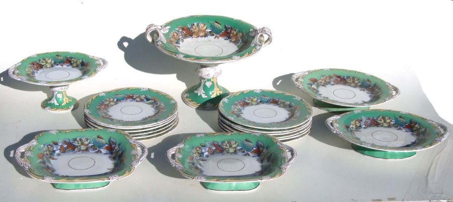 A Victorian dessert set decorated with scrolling foliage and hazelnuts on a green ground.Condition