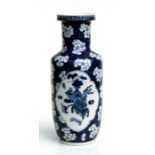 A Chinese blue & white rouleau vase decorated with birds and precious objects within panels, on a