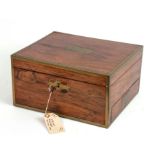 An early 19th century brass bound rosewood jewellery box with secret drawer, 29.5cms wide.