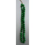 A string of jade or hardstone beads, each bead approx 12mm diameter.Condition ReportWeight 178g.