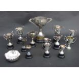 A large quantity of silver plated items, trophies together with flatware many boxed.