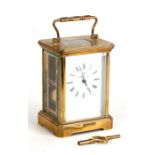 A Matthew Norman brass cased carriage time piece, numbered 1751A, 15cms high.