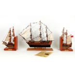 An HMS Victory Trafalgar 200 Edition model, mounted on an oak base made from timer recovered from