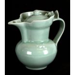 A Chinese celadon glazed 'Monk's Cap' ewer and cover with Anhuua decoration, blue seal mark to the