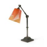 An early 20th century steel adjustable desk lamp, 43cms high.Condition ReportBase is cast iron, no