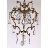 A gilt metal crystal drop chandelier.