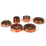 Six copper jelly moulds to include one by Maple's and another by Wilson & Smith, the largest 19cm