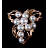 A 14ct rose gold brooch set with pearls and sapphires.