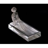 An Art Deco frosted glass pin dish depicting a young woman bathing, 10cms long.Condition